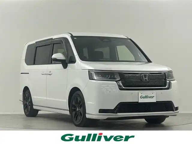 ホンダ ステップワゴン スパーダ eHEV 埼玉県 2023(令5)年 1.9万km プラチナホワイトパール ワンオーナー　純正１１．４インチナビＴＶ　純正１２インチフリップダウンモニター　パワーテールゲート　両側パワースライド　シートヒーター　純正ドライブレコーダー　ブラインドスポットモニター　ＥＴＣ　ＬＥＤヘッドライト　パドルシフト　禁煙車