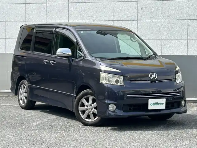 トヨタ ヴォクシー ZS 煌 東京都 2008(平20)年 13.3万km ダークバイオレットマイカメタリック 純正HDDナビ/　フルセグTV/CD/DVD/AUX/ミュージックサーバー/バックカメラ/フリップダウンモニター/ビルトインETC/パドルシフト/オートライト/純正16インチアルミホイール/純正フロアマット/両側パワースライドドア/パワーステアリング/パワーウィンドウ/LEDライト/フォグランプ/プッシュスタート/電動格納ミラー/ドアバイザー/スマートキー×2/保証書/点検記録簿/取扱説明書/スペアキー