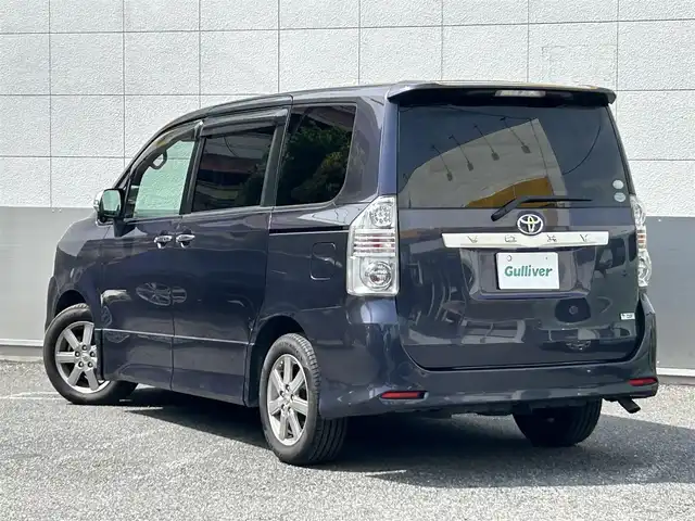 トヨタ ヴォクシー ZS 煌 東京都 2008(平20)年 13.3万km ダークバイオレットマイカメタリック 純正HDDナビ/　フルセグTV/CD/DVD/AUX/ミュージックサーバー/バックカメラ/フリップダウンモニター/ビルトインETC/パドルシフト/オートライト/純正16インチアルミホイール/純正フロアマット/両側パワースライドドア/パワーステアリング/パワーウィンドウ/LEDライト/フォグランプ/プッシュスタート/電動格納ミラー/ドアバイザー/スマートキー×2/保証書/点検記録簿/取扱説明書/スペアキー