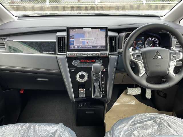 三菱 デリカＤ：５ シャモニー 山口県 2025(令7)年 0.1千km グラファイトグレーメタリック/ブラックマイカ 12インチフリップダウンモニター/社外11インチナビ/・Bluetooth/・フルセグテレビ/・HDMI/・USB入力/・Apple Car Play/・Android Auto/e-Assist/・衝突被害軽減ブレーキ/・車線逸脱警報システム/・レーダークルーズコントロール/・オートマチックハイビーム/・後側方車両検知警報システム/・誤発進抑制機能/・後退時交差車両検知システム/マルチアラウンドモニター/両側オートスライドドア/純正18インチアルミホイール/ヒルディセントコントロール/ハーフレザーシート/ハンドルヒーター/電動パーキングブレーキ/純正LEDヘッドライト/フォグライト/オートライト/プッシュスタート/スマートキー/スペアキー有/取扱説明書/保証書