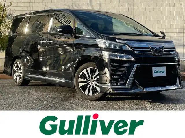 トヨタ ヴェルファイア Z Gエディション 滋賀県 2018(平30)年 4.8万km ブラック モデリスタエアロ/フリップダウンモニター/両側パワースライドドア/純正9インチナビ【NSZT-Y66T】/（AM/FM/CD/DVD/フルセグ/Bluetooth）/バックカメラ/フロントカメラ/ETC/テレビキャンセラー/デジタルインナーミラー/トヨタセーフティセンス/・踏み間違い防止アシスト/・ブレーキアシスト/・プリクラッシュブレーキアシスト/・ヒルスタート（坂道発進）アシスト/・前方衝突防止支援システム/・VDC（ビークルダイナミクスコントロール）/・レーンキープアシスト/・車間自動制御システム/・ASCD（オートスピードコントロール装置）/・ABS（アンチロックブレーキシステム）/・コーナー・バックセンサー（ソナー）/・標識検知機能/・盗難防止アラーム	/運転席・助手席シートヒーター/運転席・助手席シートクーラー/電動格納ミラー/電子パーキング/ブレーキホールド/ステアリングスイッチ/オートライト/LEDヘッドライト/フロントフォグ/フルオートエアコン/USB端子/プッシュスタート/スマートキー/純正フロアマット