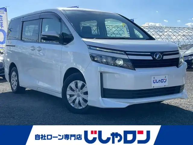 トヨタ ヴォクシー X 徳島県 2014(平26)年 12.5万km ホワイトパールクリスタルシャイン (株)IDOMが運営する【じしゃロン徳島店】の自社ローン対象車両になります。こちらは現金ご利用時の価格です。自社ローンご希望の方は別途その旨お申付け下さい。”										/																				純正ナビゲーション（SDカード後日）/（フルセグ/CD/DVD/SD/Bluetooth)/バックカメラ　/ビルトインＥＴＣ　/両側パワースライドドア　/オートＬＥＤヘッドライト　/ＬＥＤデイライト　/ウィンカーミラー/オート電動格納ミラー/プッシュスタート/スマートキー　/トラクションコントロール/ＥＣＯモード切替　/アイドリングストップ　/リヤエアコン/Wエアバック/純正フロアマット/サイドバイザー