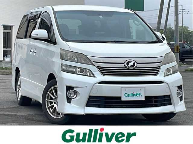 トヨタ ヴェルファイア 2．4Z 道央・札幌 2012(平24)年 12.8万km ホワイトパールクリスタルシャイン ４WD/社外HDDナビ/CD/DVD/MD/フルセグ/社外フリップダウンモニター/横滑り防止装置/クリアランスソナー/バックカメラ/ビルトインETC/センターデフロック/ECOMODE/nanoe/両側パワースライドドア/2列目オットマン/革巻きウッドコンビステアリング/ステアリングリモコン/MTモード付AT/プッシュスタート/スマートキー/HIDヘッドライト/オートライト/フォグランプ/電動格納ミラー/ウィンカーミラー/純正フロアマット/ドアバイザー/社外AW付夏タイヤ積込/235/50/R18/2017年/山6mm