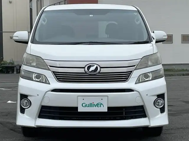 トヨタ ヴェルファイア 2．4Z 道央・札幌 2012(平24)年 12.8万km ホワイトパールクリスタルシャイン ４WD/社外HDDナビ/CD/DVD/MD/フルセグ/社外フリップダウンモニター/横滑り防止装置/クリアランスソナー/バックカメラ/ビルトインETC/センターデフロック/ECOMODE/nanoe/両側パワースライドドア/2列目オットマン/革巻きウッドコンビステアリング/ステアリングリモコン/MTモード付AT/プッシュスタート/スマートキー/HIDヘッドライト/オートライト/フォグランプ/電動格納ミラー/ウィンカーミラー/純正フロアマット/ドアバイザー/社外AW付夏タイヤ積込/235/50/R18/2017年/山6mm