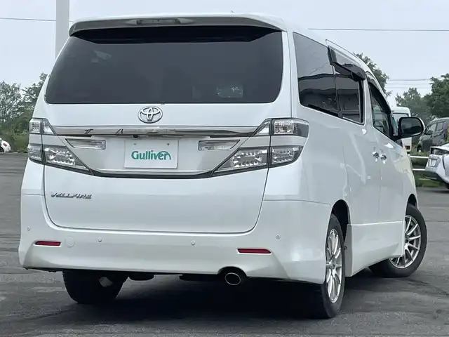 トヨタ ヴェルファイア 2．4Z 道央・札幌 2012(平24)年 12.8万km ホワイトパールクリスタルシャイン ４WD/社外HDDナビ/CD/DVD/MD/フルセグ/社外フリップダウンモニター/横滑り防止装置/クリアランスソナー/バックカメラ/ビルトインETC/センターデフロック/ECOMODE/nanoe/両側パワースライドドア/2列目オットマン/革巻きウッドコンビステアリング/ステアリングリモコン/MTモード付AT/プッシュスタート/スマートキー/HIDヘッドライト/オートライト/フォグランプ/電動格納ミラー/ウィンカーミラー/純正フロアマット/ドアバイザー/社外AW付夏タイヤ積込/235/50/R18/2017年/山6mm