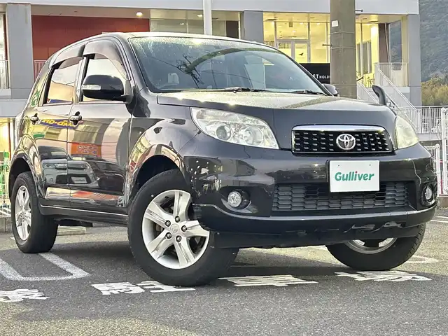 トヨタ ラッシュ G 長崎県 2011(平23)年 6.2万km ブラックマイカメタリック 社外ディスプレイオーディオ（ＣＤ／ＤＶＤ）/4WD/背面タイヤ/AAC/電動格納ミラー/キセノンヘッドライト/ABS/PW