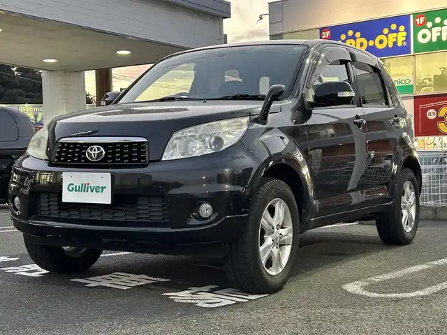 トヨタ ラッシュ G 長崎県 2011(平23)年 6.2万km ブラックマイカメタリック 社外ディスプレイオーディオ（ＣＤ／ＤＶＤ）/4WD/背面タイヤ/AAC/電動格納ミラー/キセノンヘッドライト/ABS/PW