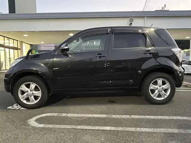 トヨタ ラッシュ G 長崎県 2011(平23)年 6.2万km ブラックマイカメタリック 社外ディスプレイオーディオ（ＣＤ／ＤＶＤ）/4WD/背面タイヤ/AAC/電動格納ミラー/キセノンヘッドライト/ABS/PW