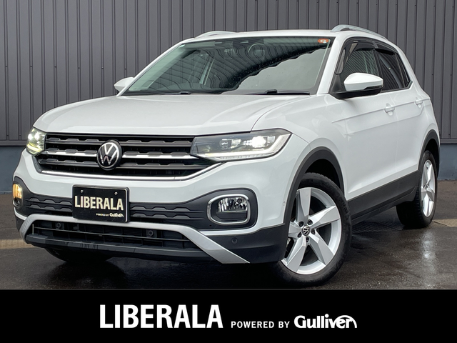 フォルクスワーゲン ＶＷ Ｔ－クロス TSI スタイル 青森県 2021(令3)年 3.6万km ピュアホワイト オプション/セーフティパッケージ/-レーンキープアシスト/-ハイビームアシスト/-パークアシスト/-ブラインドスポットアシスト/-パークディスタンスコントロール/-オプティカルパーキングシステム/-リヤトラフィックアラート/テクノロジーパッケージ/-トラベルアシスト/-ワイヤレスチャージング/-デジタルコックピットプロ/DiscoverProパッケージ/-SSDナビ/-AM/FM/Bluetooth/USB-C/CarPlay/主要装備/アダプティブクルーズコントロール/バックカメラ/ETC2.0/ドライブレコーダー/LEDヘッドライト/パドルシフト/純正17インチアルミホイール/ステアリングリモコン