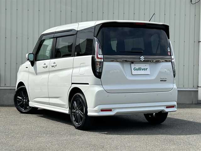 スズキ ソリオ HV SZ 山形県 2024(令6)年 0.6万km ピュアホワイトP メモリナビ/　　【CD BT ワンセグ USB】/バックカメラ/両側パワースライドドア/レーダークルーズコントロール/LEDオートヘッドライト/シートヒーター/純正15インチアルミホイール/アイドリングストップ/コーナーセンサー/ステアリングスイッチ/パドルシフト/電動格納ウィンカーミラー/フォグランプ/スマートキー/ETC