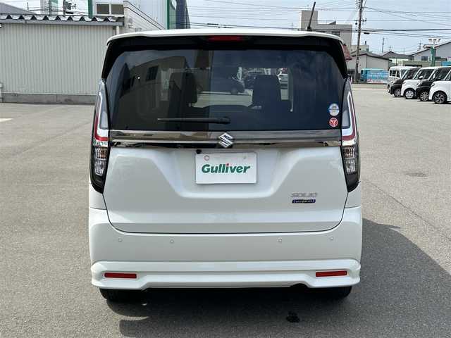 スズキ ソリオ HV SZ 山形県 2024(令6)年 0.6万km ピュアホワイトP メモリナビ/　　【CD BT ワンセグ USB】/バックカメラ/両側パワースライドドア/レーダークルーズコントロール/LEDオートヘッドライト/シートヒーター/純正15インチアルミホイール/アイドリングストップ/コーナーセンサー/ステアリングスイッチ/パドルシフト/電動格納ウィンカーミラー/フォグランプ/スマートキー/ETC
