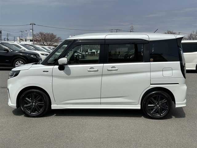 スズキ ソリオ HV SZ 山形県 2024(令6)年 0.6万km ピュアホワイトP メモリナビ/　　【CD BT ワンセグ USB】/バックカメラ/両側パワースライドドア/レーダークルーズコントロール/LEDオートヘッドライト/シートヒーター/純正15インチアルミホイール/アイドリングストップ/コーナーセンサー/ステアリングスイッチ/パドルシフト/電動格納ウィンカーミラー/フォグランプ/スマートキー/ETC