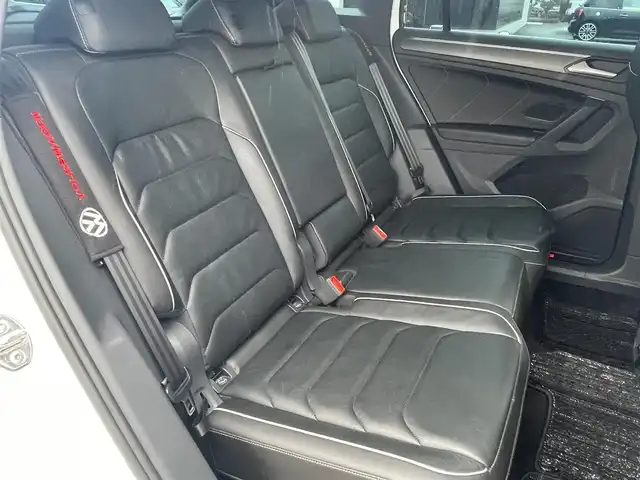 フォルクスワーゲン ＶＷ ティグアン TSI Rライン 静岡県 2021(令3)年 3.9万km オリックスホワイトパールエフェクト ワンオーナー /DiscoverPRO ナビBluetooth CarPlay対応/デジタルメーター/ヘッドアップディスプレイ/パノラマサンルーフ/ブラックレザーシートシートヒーター /ステアリングヒーター/前席メモリーパワーシート/harman/kardonサラウンド/パワーバックドア /フロントアシスト サイドアシスト/レーンチェンジアシスト/前後ドライブレコーダー/DSRCETC/フィルム施工