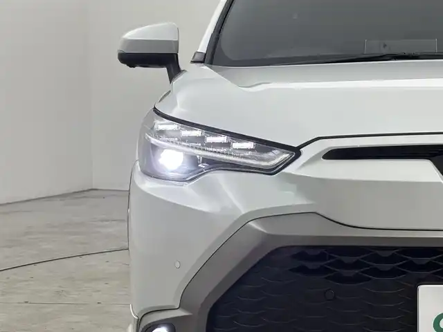 トヨタ カローラ クロス ハイブリッド Z 福岡県 2024(令6)年 1.3万km プラチナホワイトパールマイカ ワンオーナー　/モデリスタエアロ　/純正１０．５型ＤＡナビ/フルセグTV　/全方位カメラ　/ビルトインＥＴＣ２．０　/トヨタセーフティセンス　/レーダークルーズコントロール　/コーナーセンサー　/衝突軽減ブレーキ　/レーンキープ　/ブラインドスポットモニター　/アクセル踏み間違い防止　/パーキングアシスト　/パワーバックドア　/ハーフレザーシート　/パワーシート/シートヒーター　/ステアリングヒーター　/ルーフレール/ＬＥＤヘッドライト　/純正アルミホイール