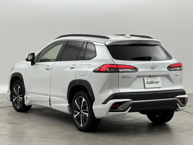 トヨタ カローラ クロス ハイブリッド Z 福岡県 2024(令6)年 1.3万km プラチナホワイトパールマイカ ワンオーナー　/モデリスタエアロ　/純正１０．５型ＤＡナビ/フルセグTV　/全方位カメラ　/ビルトインＥＴＣ２．０　/トヨタセーフティセンス　/レーダークルーズコントロール　/コーナーセンサー　/衝突軽減ブレーキ　/レーンキープ　/ブラインドスポットモニター　/アクセル踏み間違い防止　/パーキングアシスト　/パワーバックドア　/ハーフレザーシート　/パワーシート/シートヒーター　/ステアリングヒーター　/ルーフレール/ＬＥＤヘッドライト　/純正アルミホイール