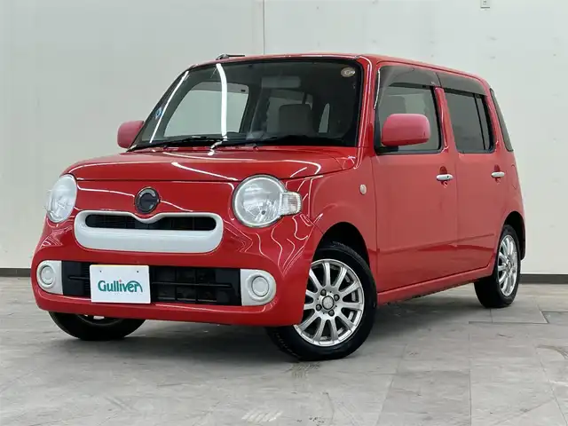 ダイハツ ミラ ココア X 道央・札幌 2016(平28)年 10.3万km シャイニングレッド ・4WD/・社外ナビ(DVD&CD&BT&フルセグ）/・電動格納ミラー/・ドアバイザー/・アイドリングストップ/・純正フロアマット/・ベンチシート/・社外アルミホイール/・キーレス/・ETC/・Wエアバッグ