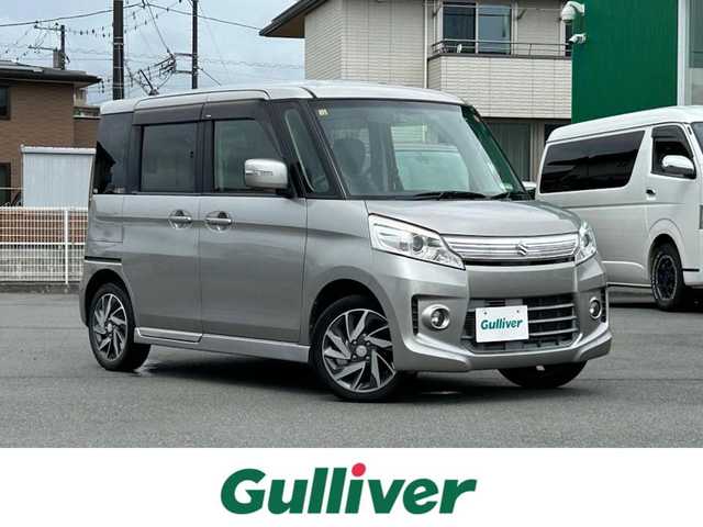 スズキ スペーシア カスタム TS 静岡県 2013(平25)年 8.7万km スチールシルバーM 社外ＳＤナビ（CD、ワンセグTV、DVD、SDミュージックサーバー、AUX）/バックカメラ/前方ドライブレコーダー/両側パワースライドドア/純正アルミホイール/純正フロアマット/スマートキー/プッシュスタート/オートライト/ベンチシート/オートエアコン/保証書/取扱説明書/記録簿/パワーウインドウ/パワーステアリング/ABS/盗難防止装置/キセノンヘッドライト/ダブルエアバッグ/ハーフレザーシートカバー/フォグランプ
