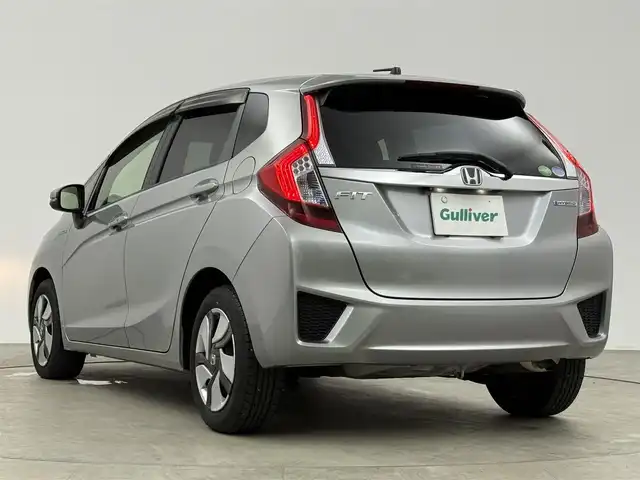 ホンダ フィット ハイブリット Fパッケージ 愛知県 2015(平27)年 9.1万km ティンテッドシルバーM 純正ナビ/（CD/DVD/Bluetooth/ワンセグ）/ETC/バックカメラ/横滑り防止/ステアスイッチ/ECOモード付き/ドアバイザー/電格ミラー/スマートキー/プッシュスタート/ハロゲンヘッドライト/マニュアルレベライザー