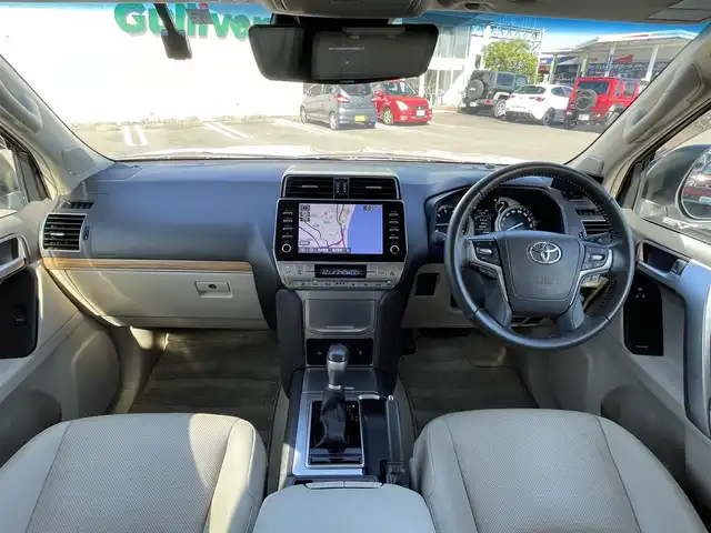 トヨタ ランドクルーザー プラド TX Lパッケージ マットブラED 宮崎県 2023(令5)年 4万km ホワイトパールクリスタルシャイン サンルーフ/純正ディスプレイオーディオ/・Bluetooth・USB・AM・FM・ナビ/HDMI/衝突軽減ブレーキ/レーダークルーズコントロール/パノラミックビューモニター/ブラインドスポットモニター/オートハイビームアシスト/前後コーナーセンサー/ミラー一体型ドライブレコーダー/純正レーダー【TZ-R203L/ビルトインETC/D/N席パワーシート/電動格納サードシート/D/N席シートヒーター・ベンチレーション/ベージュレザーシート/ルーフレール/純正フロアマット/純正18インチアルミホイール