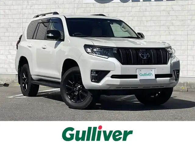 トヨタ ランドクルーザー プラド TX Lパッケージ マットブラED 宮崎県 2023(令5)年 4万km ホワイトパールクリスタルシャイン サンルーフ/純正ディスプレイオーディオ/・Bluetooth・USB・AM・FM・ナビ/HDMI/衝突軽減ブレーキ/レーダークルーズコントロール/パノラミックビューモニター/ブラインドスポットモニター/オートハイビームアシスト/前後コーナーセンサー/ミラー一体型ドライブレコーダー/純正レーダー【TZ-R203L/ビルトインETC/D/N席パワーシート/電動格納サードシート/D/N席シートヒーター・ベンチレーション/ベージュレザーシート/ルーフレール/純正フロアマット/純正18インチアルミホイール