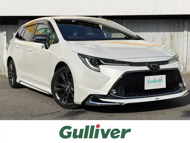 トヨタ カローラツーリング ダブルバイビー 三重県 2021(令3)年 4.6万km プラチナホワイトパールマイカ モデリスタ/　・フロント/　・サイド/　・リアアンダー/トヨタセーフティセンス/　・プリクラッシュセーフティ/　・レーントレーシングアシスト/　・ブラインドスポットモニター/　・クリアランスソナー/　・レーダークルーズコントロール/　・リアクロストラフィックアラート/　・パーキングサポートブレーキ/　・ロードサインアシスト/　・オートハイビーム/純正ナビ/　・AppleCarPlay/　・AndroidAuto/　・Bluetooth/　・フルセグTV/　・ミラキャスト/　・DVD/CD再生/　・USB/純正デジタルインナーミラー/バックガイドカメラ/スポーツモード/プッシュスタート/ハーフレザーシート/D/N席シートヒーター/革巻きステアリング/ステアリングヒーター/ステアリングスイッチ/LEDヘッドライト/LEDフォグライト/オートライト/オートリトラクタブルミラー/ウィンカーミラー/ビルトインETC2.0/ドライブレコーダー前後/後部座席充電用USBポートx２/スペアタイヤ/プライバシーガラス/ドアバイザー/ルーフアンテナ/純正フロアマット/横滑り防止機能/サイド/カーテン/ニーエアバック