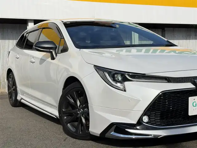 トヨタ カローラツーリング ダブルバイビー 三重県 2021(令3)年 4.6万km プラチナホワイトパールマイカ モデリスタ/　・フロント/　・サイド/　・リアアンダー/トヨタセーフティセンス/　・プリクラッシュセーフティ/　・レーントレーシングアシスト/　・ブラインドスポットモニター/　・クリアランスソナー/　・レーダークルーズコントロール/　・リアクロストラフィックアラート/　・パーキングサポートブレーキ/　・ロードサインアシスト/　・オートハイビーム/純正ナビ/　・AppleCarPlay/　・AndroidAuto/　・Bluetooth/　・フルセグTV/　・ミラキャスト/　・DVD/CD再生/　・USB/純正デジタルインナーミラー/バックガイドカメラ/スポーツモード/プッシュスタート/ハーフレザーシート/D/N席シートヒーター/革巻きステアリング/ステアリングヒーター/ステアリングスイッチ/LEDヘッドライト/LEDフォグライト/オートライト/オートリトラクタブルミラー/ウィンカーミラー/ビルトインETC2.0/ドライブレコーダー前後/後部座席充電用USBポートx２/スペアタイヤ/プライバシーガラス/ドアバイザー/ルーフアンテナ/純正フロアマット/横滑り防止機能/サイド/カーテン/ニーエアバック