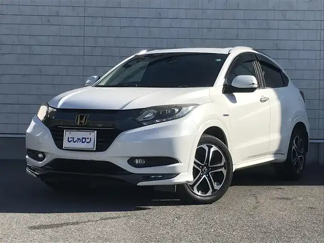 ホンダ ヴェゼル ハイブリッド Z 栃木県 2015(平27)年 9.9万km ホワイトオーキッドパール (株)IDOMが運営する【じしゃロン小山店】の自社ローン対象車両になります。こちらは現金ご利用時の価格です。/自社ローンご希望の方は別途その旨お申付け下さい。//禁煙車/純正フルセグナビ/（CD/DVD/AM/FMラジオ）/(Bluetooth)/スマートキー/プッシュスタート/バックカメラ/ＥＴＣ/クルーズコントロール/シティブレーキアクティブシステム/ルーフレール/シートヒーター/チップアップシート/パドルシフト/ステアリングリモコン/電動格納ドアミラー/パワーウインドウ/オートライト/自動防眩ミラー