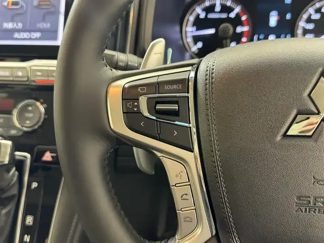 三菱 デリカＤ：５ ブラックエディション 滋賀県 2025(令7)年 0.1千km ホワイトダイヤモンド 届出済み未使用車/ALPINE11インチナビ/【Bluetooth/CD/DVD/フルセグTV】/レザーシート/両側パワースライドドア/全方位カメラ/追従クルーズコントロール/ブラインドスポットモニタリング/LEDヘッドライト/オートマチックハイビーム/D席パワーシート/D/Nシートヒーター/ステアリングヒーター/パワーバックドア/AC100V電源/電動パーキングブレーキ/オートブレーキホールド/パドルシフト/プッシュスタート/スマートキー/ステアリングリモコン