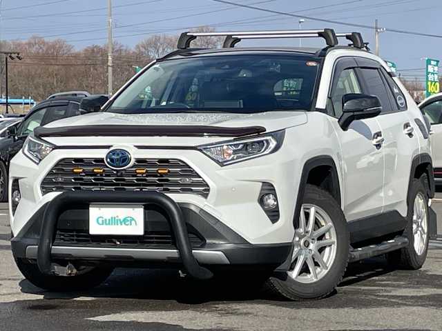 トヨタ ＲＡＶ４ ハイブリットG 道央・札幌 2021(令3)年 3.9万km ホワイトパールクリスタルシャイン ４ＷＤ/ワンオーナー/サンルーフ/純正ナビ/パノラミックビューモニター/ワイパーデアイサー/革巻きステアリング/ステアリングスイッチ/レーダークルーズコントロール/ＬＥＤ/フォグ／リアフォグランプ/オートライト/オートハイビーム/ウィンカーミラー/運転席パワーシート/前席シートヒーター/プリクラッシュセーフティ/レーンキープアシスト/ブラインドスポットモニタリング/リアクロストラフィックアラート/パーキングサポートブレーキ/ロードサインアシスト/コーナーセンサー/横滑り防止装置/バグガード/バンパーガード/社外ステップ/ＴＲＤマフラー/ＴＲＤマッドフラップ/ラダー/ルーフキャリア/プッシュスタート/純正ドアバイザー/ニーエアバッグ/純正エンジンスターター