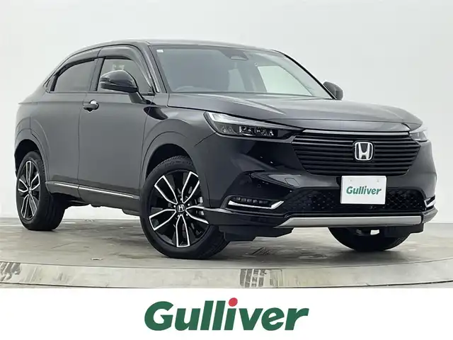 ホンダ ヴェゼル ハイブリッド e:HEV Z 宮城県 2021(令3)年 7.5万km クリスタルブラックパール 4WD/純正ナビ/（フルセグ/Bluetooth/AM/FM/HDMI）/バックカメラ/スペアキー×1/前後ドライブレコーダー/ETC2.0/デジタルインナーミラー/置くだけ充電/パドルシフト/レーダークルーズコントロール/レーンキープアシスト/衝突被害軽減システム/横滑り防止装置/クリアランスソナー/ブラインドスポットモニター/ステアリングヒーター/カーテンエアバッグ/パワーバックドア/ハーフレザー/前席シートヒーター/純正18インチAW/純正LEDヘッドライト/純正フロアマット/保証書