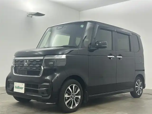 ホンダ Ｎ ＢＯＸ カスタム 岡山県 2024(令6)年 0.7万km クリスタルブラックパール 純正９インチメモリーナビ/（Ｂｌｕｅｔｏｏｔｈ/フルセグ/HDMI/USB/Carplay/Android Auto)/衝突軽減ブレーキシステム　/両側パワースライドドア/レーダークルーズコントロール/踏み間違い防止/純正ドライブレコーダー（前後）/シートヒーター(D/N)/オートハイビーム/オートライト/ＬＥＤヘッドライト/バックカメラ/コーナーセンサー（前後）/オートブレーキホールド/シートカバー（黒）/ISOFIX/後席サンシェイド/ステアリングスイッチ/チルトステアリング/シートリフター/シートバックテーブル/ウインカーミラー/ドアバイザー/チップアップシート/プッシュスタート/スマートキー/新車保証書/取扱説明書