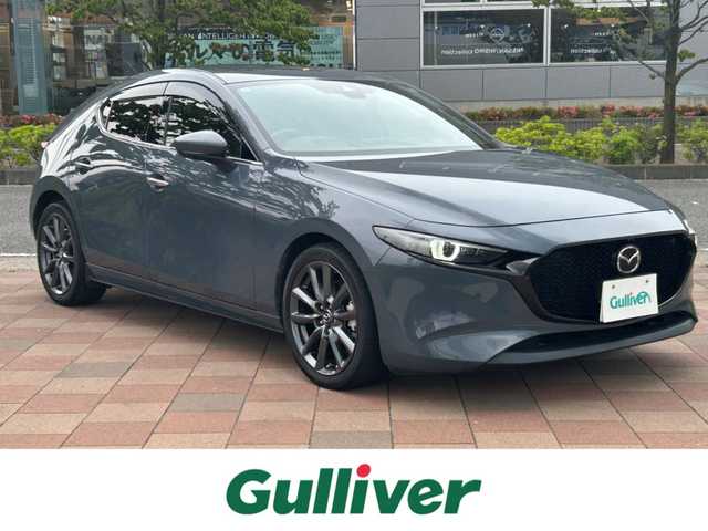 マツダ マツダ３ファストバック XD バーガンディセレクション 福島県 2019(令1)年 2.5万km ポリメタルグレーM メーカーナビ/(CD/DVD/BT/HDMI/AM/FM)/赤レザーシート/衝突軽減ブレーキ/レーンキープ/ブラインドスポットモニター/ヘッドアップディスプレイ/レーダークルーズコントロール/全方位カメラ/LEDオートライト/運転席メモリーシート/前席シートヒーター/ハンドルヒーター/前後ドライブレコーダー/パドルシフト/ETC/プッシュスタート/コーナーセンサー/アイドリングストップ/ステアリングスイッチ/純正フロアマット/ドアバイザー