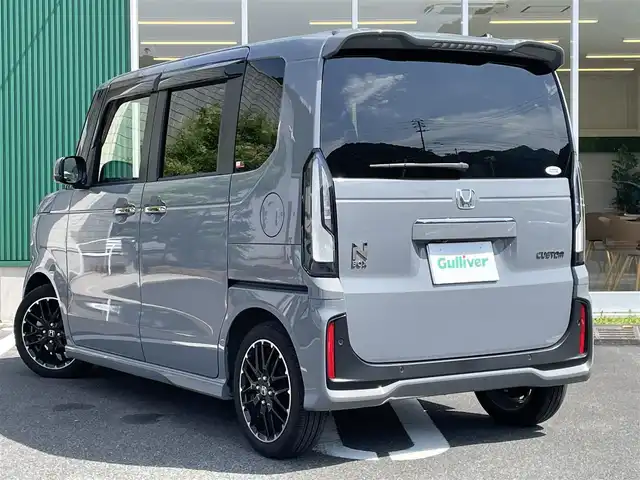 ホンダ Ｎ ＢＯＸ カスタム ターボ コーディネートS 愛媛県 2024(令6)年 1万km グレー ワンオーナー/禁煙車/純正メモリナビ/・フルセグTV/Bluetooth/USB/バックカメラ/前後ドライブレコーダー/両側パワースライドドア /2列目サンシェード/革シート/・D/N席シートヒーター/パドルシフト/LEDオートライト/ETC/ホンダセンシング /・衝突軽減ブレーキ/・先行車発進お知らせ/・歩行者事故低減ステアリング/・路外逸脱抑制機能/・標識認識機能/・渋滞追従機能付きアダクティブクルーズコントロール/・車線維持支援システム/・誤発進抑制機能(前後)/・近距離衝突軽減ブレーキ/・急アクセル抑制機能/・パーキングセンサーシステム/・オートハイビーム /オートブレーキホールド/・電動パーキングブレーキ/取扱説明書/保証書/プッシュスタート/・スマートキー/スペアキー