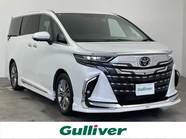 トヨタ アルファード Z 大分県 2023(令5)年 2.7万km プラチナホワイトパールマイカ ワンオーナー/モデリスタエアロ/・フロントスポイラー/・サイドスカート/・リヤスタイリングキット/(リヤスカート+ドレスアップマフラー)/・フロントグリル/・シグネチャーイルミブレード/左右独立ムーンルーフ/パノラミックビューモニター/14インチHDディスプレイディスプレイオーディオ/・ナビ機能有り、USB入力、HDMI入力端子/・フルセグTV、BT対応、AM/FM/・AppleCarPlay、AndroidAuto、Miracast/TVキット/ステアリングスイッチ/後席ディスプレイ/両側電動スライドドア/デジタルインナーミラー /ビルトインETC2.0/社外ドライブレコーダー（前後）/パワーバックドア/横滑り防止装置/電動格納ミラー/オートライト/LEDヘッドライト/LEDフォグ/純正18インチアルミホイール/保証書、取説、スペアキー、リモコン有り
