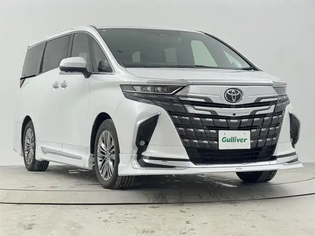 トヨタ アルファード Z 熊本県 2023(令5)年 2.7万km プラチナホワイトパールマイカ ワンオーナー/モデリスタエアロ/・フロントスポイラー/・サイドスカート/・リヤスタイリングキット/(リヤスカート+ドレスアップマフラー)/・フロントグリル/・シグネチャーイルミブレード/左右独立ムーンルーフ/パノラミックビューモニター/14インチHDディスプレイディスプレイオーディオ/・ナビ機能有り、USB入力、HDMI入力端子/・フルセグTV、BT対応、AM/FM/・AppleCarPlay、AndroidAuto、Miracast/TVキット/ステアリングスイッチ/後席ディスプレイ/両側電動スライドドア/デジタルインナーミラー /ビルトインETC2.0/社外ドライブレコーダー（前後）/パワーバックドア/横滑り防止装置/電動格納ミラー/オートライト/LEDヘッドライト/LEDフォグ/純正18インチアルミホイール/保証書、取説、スペアキー、リモコン有り