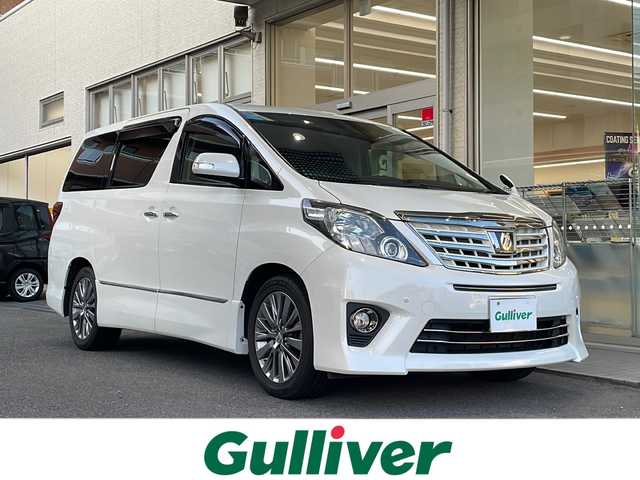 トヨタ アルファード 350S タイプゴールドⅡ 高知県 2014(平26)年 3.9万km ホワイトパールクリスタルシャイン 社外ナビ/(Bluetooth/CD/SD/DVD/USB/フルセグ)/フリップダウンモニター/システムコンソールBOX/(ヒーター/クーラー)/サンルーフ/ビルトインETC/バックカメラ/サイドカメラ/クルーズコントロール/両側パワースライドドア/パワーバックドア/純正18インチアルミホイール/オートライト/LEDヘッドライト/フォグランプ/アダプティブフロントライティングシステム/プッシュスタート/スマートキー/100V充電/MTモード付AT/オットマン/3列シート/横滑り防止装置/盗難防止装置/衝突被害軽減ブレーキ/オートリトラクタブルミラー/純正フロアマット/ドアバイザー