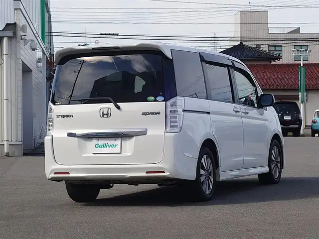 ホンダ ステップワゴン スパーダ パワーエディション 山形県 2013(平25)年 13.6万km ホワイトオーキッドパール 4WD/ワンオーナー/純正フリップダウン/純正メモリナビ/　　【CD DVD フルセグ USB】/バックカメラ/両側パワースライドドア/HIDオートヘッドライト/純正16インチアルミホイール/アイドリングストップ/ステアリングスイッチ/パドルシフト/電動格納ウィンカーミラー/純正フロアマット/ドアバイザ―/スマートキー/ETC