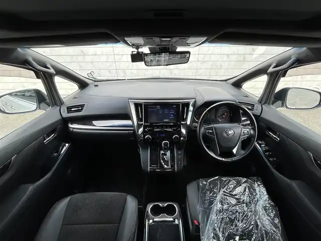 トヨタ アルファード S タイプゴールド 福岡県 2021(令3)年 5.7万km ホワイトパールクリスタルシャイン 純正9型ナビ(フルセグTV/CD/DVD/BT)バックモニター純正フリップダウンモニターWサンルーフ三眼LEDヘッドライトシーケンシャルウィンカーモデリスタエアロトヨタセーフティーセンス前後ドラレコETC2.0電動リアゲート両側パワスラコーナーセンサーレーダークルコンデジタルインナーミラーBSMオットマンUSBポート純正アルミホイール18インチ純正フロアマットスマートキープッシュスタート