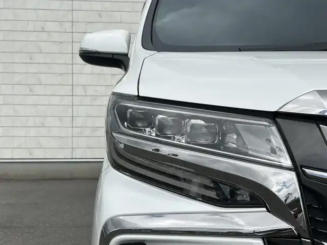 トヨタ アルファード S タイプゴールド 福岡県 2021(令3)年 5.7万km ホワイトパールクリスタルシャイン 純正9型ナビ(フルセグTV/CD/DVD/BT)バックモニター純正フリップダウンモニターWサンルーフ三眼LEDヘッドライトシーケンシャルウィンカーモデリスタエアロトヨタセーフティーセンス前後ドラレコETC2.0電動リアゲート両側パワスラコーナーセンサーレーダークルコンデジタルインナーミラーBSMオットマンUSBポート純正アルミホイール18インチ純正フロアマットスマートキープッシュスタート