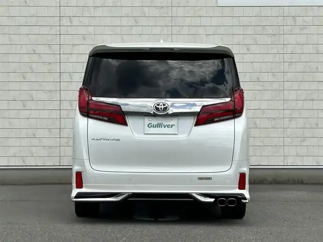 トヨタ アルファード S タイプゴールド 福岡県 2021(令3)年 5.7万km ホワイトパールクリスタルシャイン 純正9型ナビ(フルセグTV/CD/DVD/BT)バックモニター純正フリップダウンモニターWサンルーフ三眼LEDヘッドライトシーケンシャルウィンカーモデリスタエアロトヨタセーフティーセンス前後ドラレコETC2.0電動リアゲート両側パワスラコーナーセンサーレーダークルコンデジタルインナーミラーBSMオットマンUSBポート純正アルミホイール18インチ純正フロアマットスマートキープッシュスタート