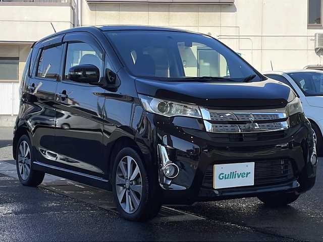 三菱 ｅＫカスタム T 岡山県 2014(平26)年 7.5万km ディープブラックマイカ 登録時走行距離74899km/純正SDナビ/(AM/FM/DISC/TV)/バックカメラ/ETC/ドライブレコーダー/プッシュスタート/USB入力端子/スマートキー/スペアキー/純正15インチアルミホイール/記録簿/保証書/取扱説明書/純正フロアマット/電動格納ミラー