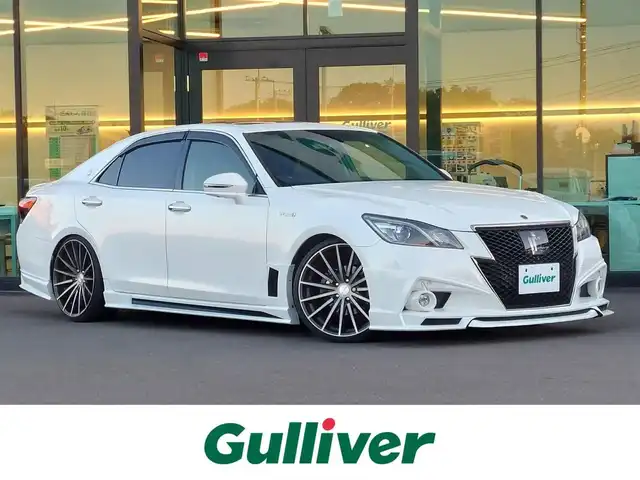 トヨタ クラウン ハイブリッド アスリートS ブラックスタイル 東京都 2015(平27)年 5.2万km ホワイトパールクリスタルシャイン ROJAMフルエアロ/ROJAM4本出しマフラー/サンルーフ/セーフティセンス/プリクラッシュセーフティ/レーンキープアシスト/レーダークルーズコントロール/純正SDナビ/パノラミックビューモニター/CD/DVD/BT/AM/FM/TV/レザーシート/シートヒーター/パワーシート/社外20インチAW/車高調キット/ビルトインETC