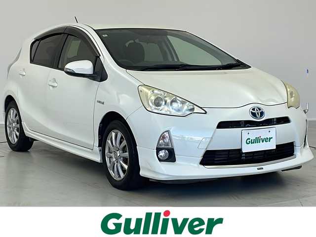 トヨタ アクア S 茨城県 2012(平24)年 7.6万km ライムホワイトパールクリスタルシャイン モデリスタエアロ/純正ナビ/　（CD/DVD/Bluetooth/TV）/バックカメラ/ETC/ステアリングスイッチ/ドライブレコーダー/電動格納ミラー/純正フロアマット/HIDライト/オートライト/プッシュスタート/スマートキー