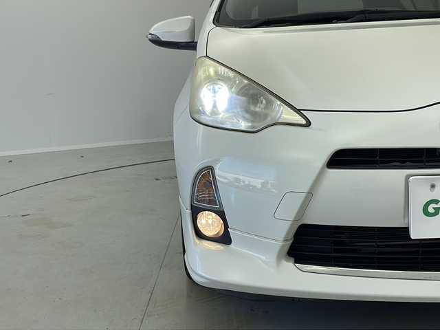 トヨタ アクア S 茨城県 2012(平24)年 7.6万km ライムホワイトパールクリスタルシャイン モデリスタエアロ/純正ナビ/　（CD/DVD/Bluetooth/TV）/バックカメラ/ETC/ステアリングスイッチ/ドライブレコーダー/電動格納ミラー/純正フロアマット/HIDライト/オートライト/プッシュスタート/スマートキー