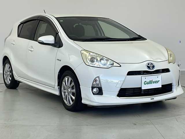 トヨタ アクア S 茨城県 2012(平24)年 7.6万km ライムホワイトパールクリスタルシャイン モデリスタエアロ/純正ナビ/　（CD/DVD/Bluetooth/TV）/バックカメラ/ETC/ステアリングスイッチ/ドライブレコーダー/電動格納ミラー/純正フロアマット/HIDライト/オートライト/プッシュスタート/スマートキー