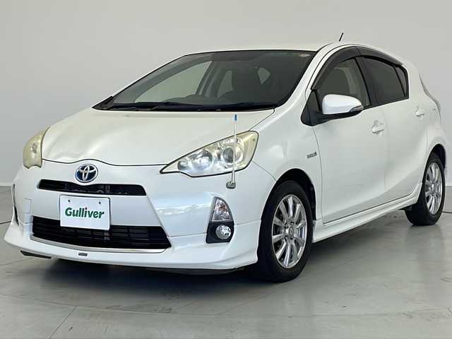 トヨタ アクア S 茨城県 2012(平24)年 7.6万km ライムホワイトパールクリスタルシャイン モデリスタエアロ/純正ナビ/　（CD/DVD/Bluetooth/TV）/バックカメラ/ETC/ステアリングスイッチ/ドライブレコーダー/電動格納ミラー/純正フロアマット/HIDライト/オートライト/プッシュスタート/スマートキー