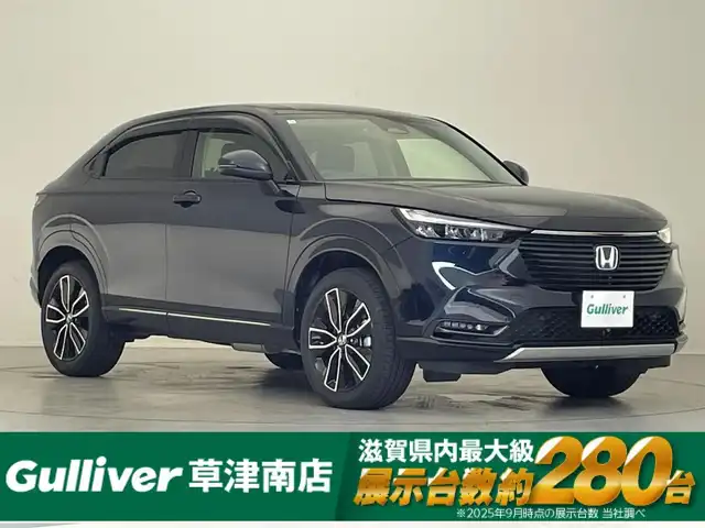 ホンダ ヴェゼル ハイブリッド e:HEV Z 滋賀県 2023(令5)年 1.4万km ミッドナイトブルービームM 純正9型ナビ/・Bluetooth/USB/フルセグ/バックカメラ/追従クルーズコントロール/パワーリアゲート/LEDライト/ハーフレザーシート/シートヒーター/ステアリングヒーター/前後ソナー/純正１８AW/オートライト/オートハイビーム/電子パーキング