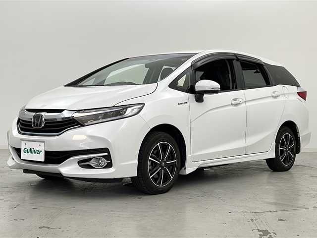 ホンダ シャトル ハイブリッド X ホンダセンシング 宮城県 2019(令1)年 3.5万km プラチナホワイトパール 禁煙車/４ＷＤ/Honda SENSING/・衝突軽減ブレーキ/・路外逸脱抑制機能/・先行車発進お知らせ機能/・アダプティブクルーズコントロール/・車線維持支援システム/純正7インチナビ/・ＣＤ.ＤＶＤ.Bluetooth.USB/・フルセグTV/バックカメラ/前席シートヒーター/ビルトインETC/ドライブレコーダー（F.R）/パドルシフト/プッシュスタート/スマートキー/LEDヘッドライト/社外15インチAW/純正ホイルキャップ付きスタッドレスタイヤ４本積み込み/純正フロアマット