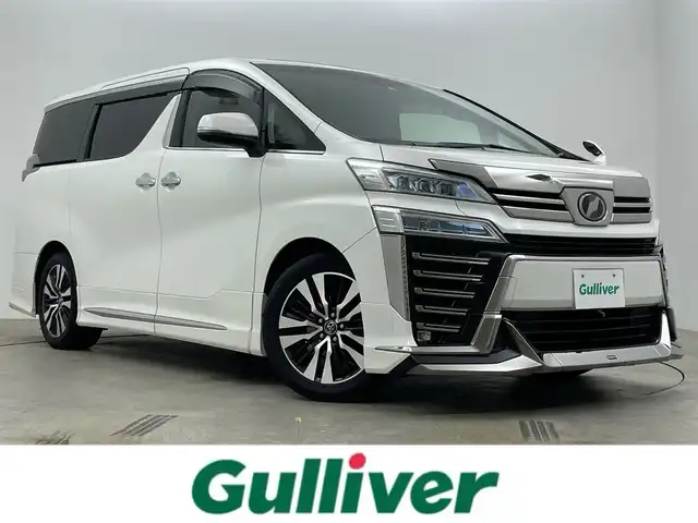 トヨタ ヴェルファイア Z Gエディション 岡山県 2018(平30)年 7.7万km ホワイトパールクリスタルシャイン アルパインＢＩＧＸ１１インチナビ/（HDMI接続/Bluetooth/フルセグTV）/アルパイン１２．８インチフリップダウンモニター/サンルーフ/本革/モデリスタフルエアロ/衝突軽減ブレーキ/レーダークルーズコントロール/ビルトインＥＴＣ/三眼ＬＥＤヘッドライト/オートハイビーム/シートヒーター/エアシート/ステアリングヒーター/コーナーセンサー/プッシュスタート/スマートキー/パワーシート/純正フロアマット/純正18インチアルミホイール＋サマータイヤ：装着/両側電動スライドドア/踏み間違い防止