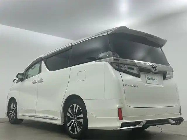 トヨタ ヴェルファイア Z Gエディション 岡山県 2018(平30)年 7.7万km ホワイトパールクリスタルシャイン アルパインＢＩＧＸ１１インチナビ/（HDMI接続/Bluetooth/フルセグTV）/アルパイン１２．８インチフリップダウンモニター/サンルーフ/本革/モデリスタフルエアロ/衝突軽減ブレーキ/レーダークルーズコントロール/ビルトインＥＴＣ/三眼ＬＥＤヘッドライト/オートハイビーム/シートヒーター/エアシート/ステアリングヒーター/コーナーセンサー/プッシュスタート/スマートキー/パワーシート/純正フロアマット/純正18インチアルミホイール＋サマータイヤ：装着/両側電動スライドドア/踏み間違い防止